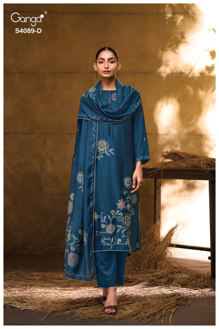 Woman wearing a blue embroidered outfit with a warm background
