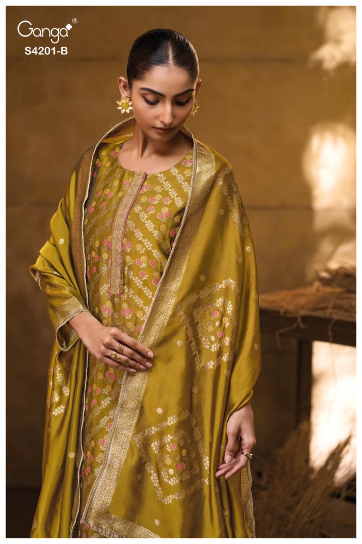 Woman wearing a traditional outfit with a gold dupatta in a warm-toned setting