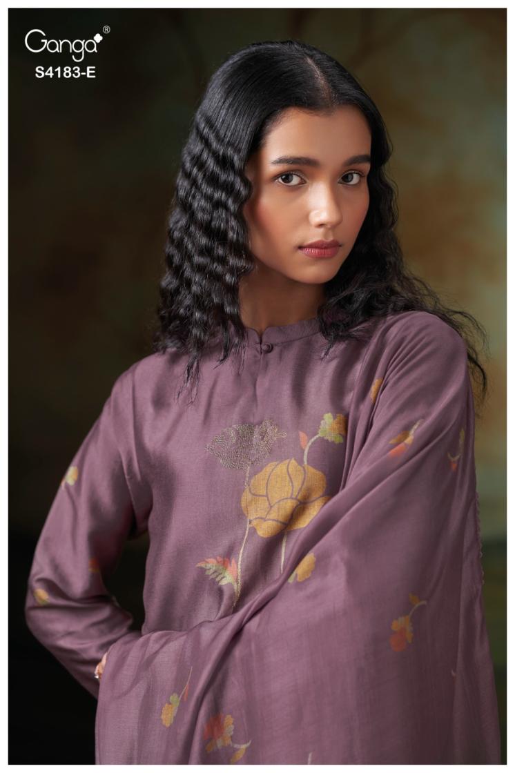 Woman wearing a purple floral dress with a dark background