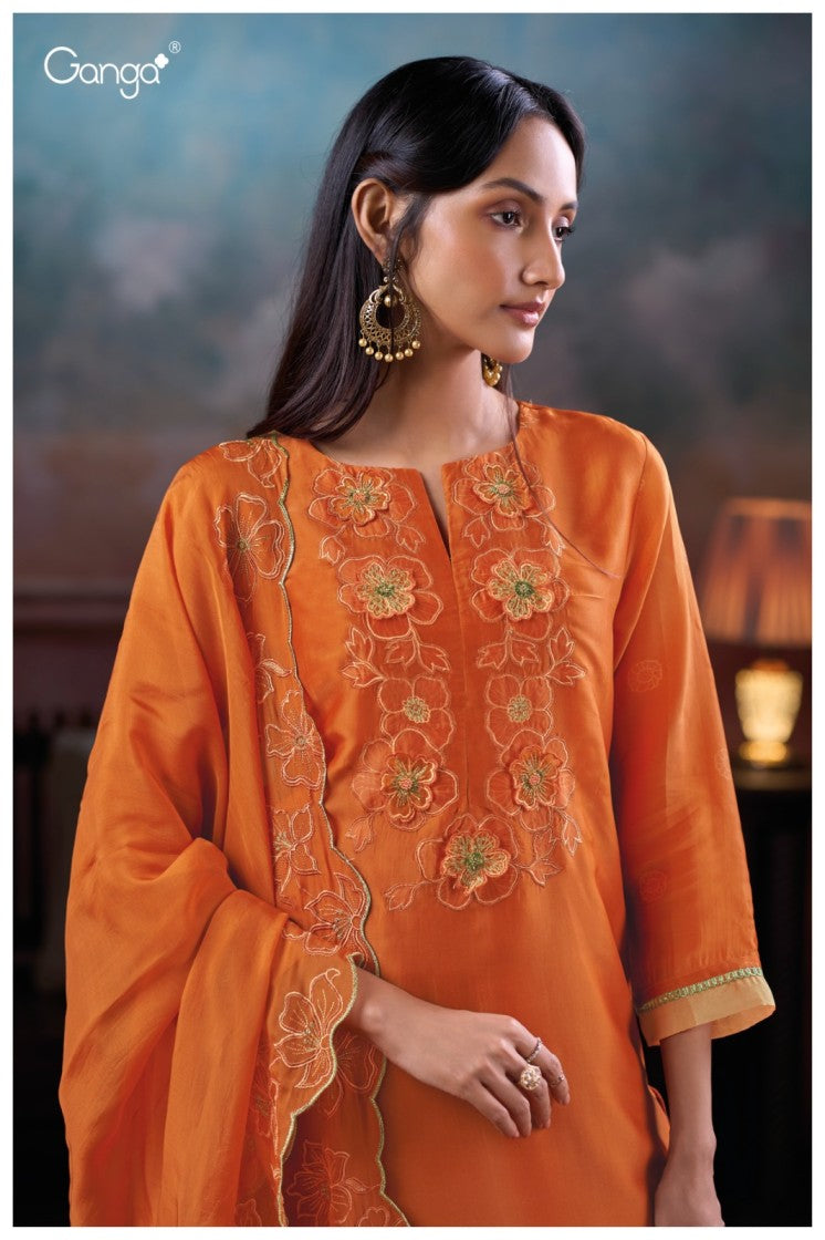 Woman wearing an orange embroidered traditional outfit with a blurred background
