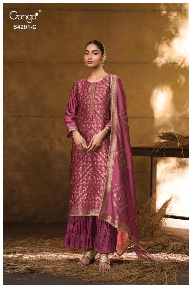 Woman wearing a traditional maroon outfit with a dupatta against a warm-toned background