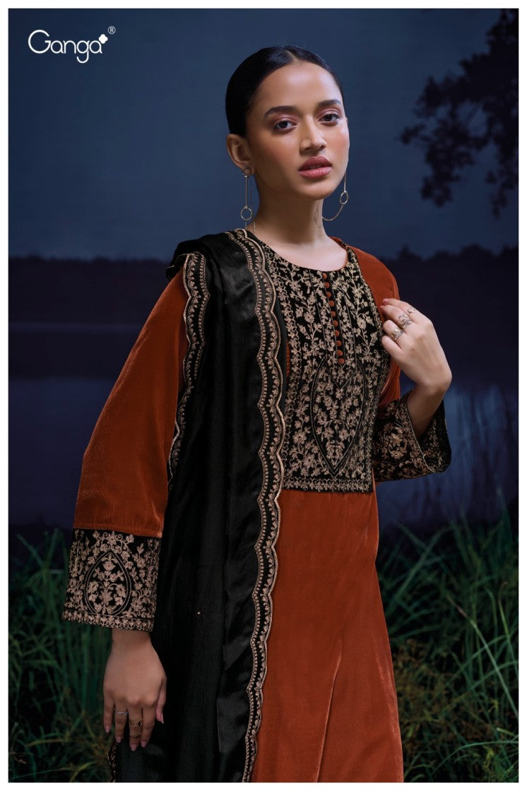 Woman wearing a traditional outfit with intricate patterns against a dark background